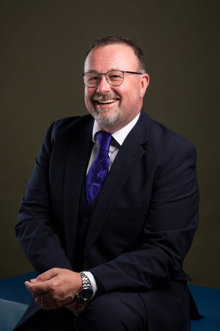 A man in a dark blue suit